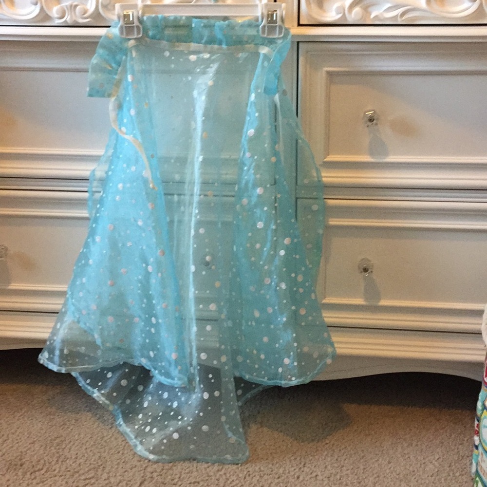 Blue cape with white polka dots